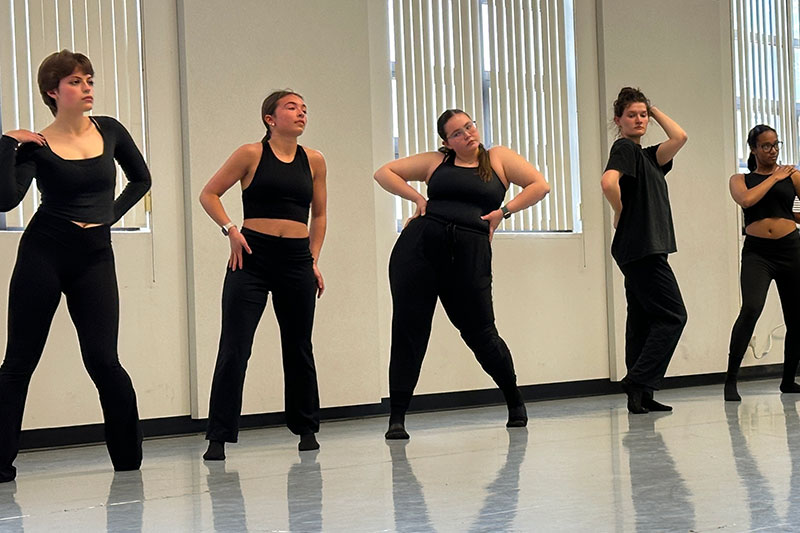 Young dancers dressed in black