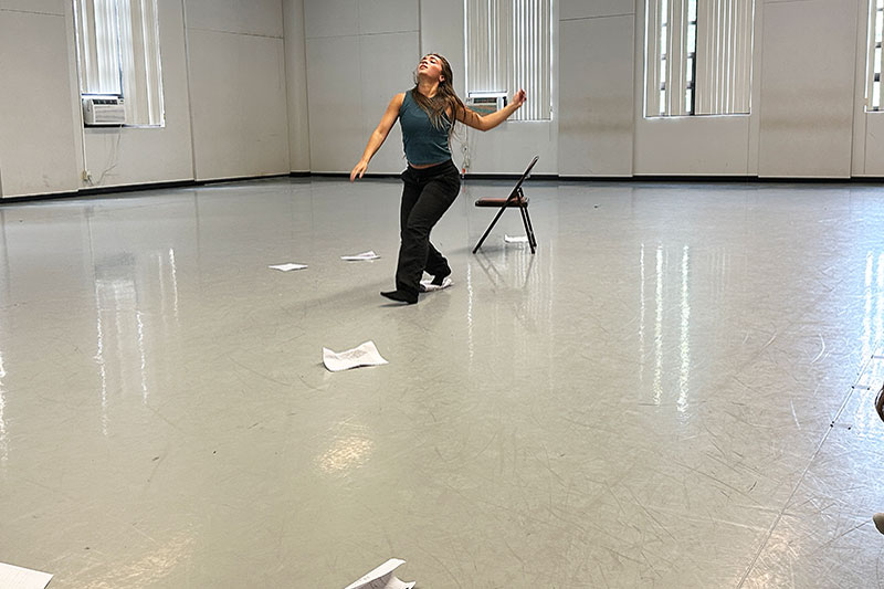 Young woman dancing in studio