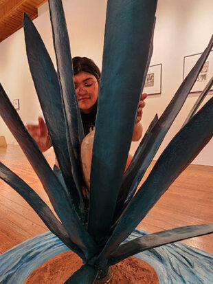 Woman installing an art exhibit