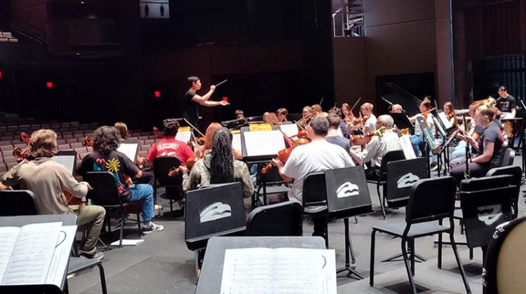 Woman conducting an orchestra