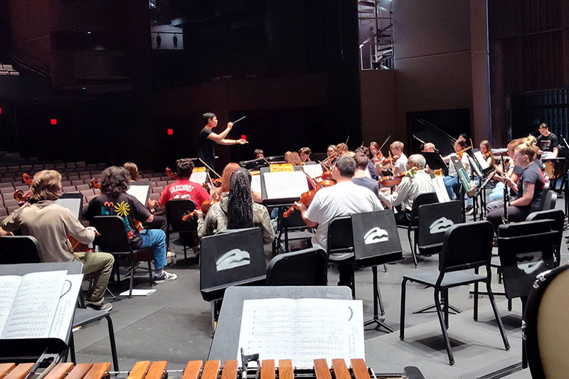 Woman conducting an orchestra