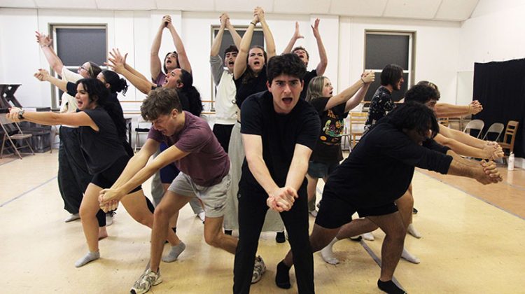 Group of young actors performing choreography