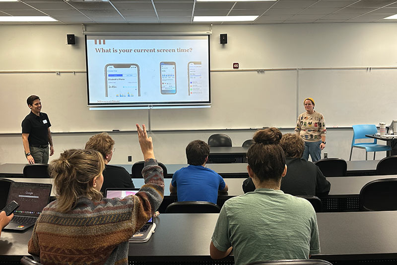 Students listening to a presentation