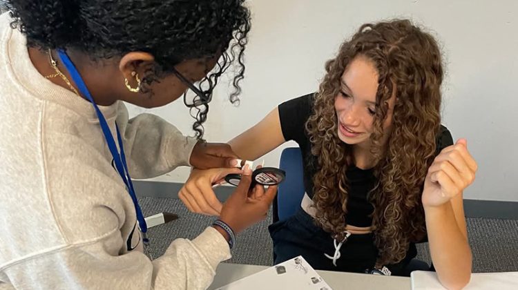 Two students practicing fingerprinting