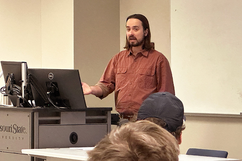 Professor speaking in front of classroom