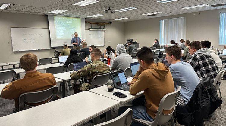 Man lecturing to a classroom of students