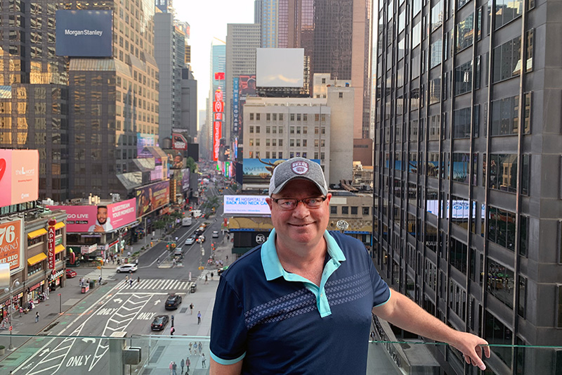 Mark Templeton on balcony in New York City