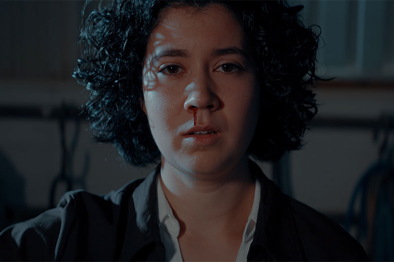 Close up of actress in darkened area