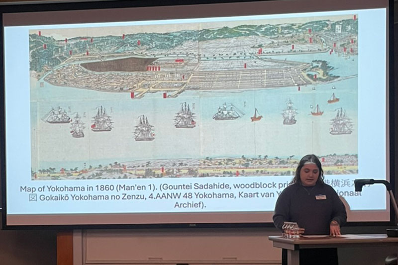 Young woman presents her research at a conference