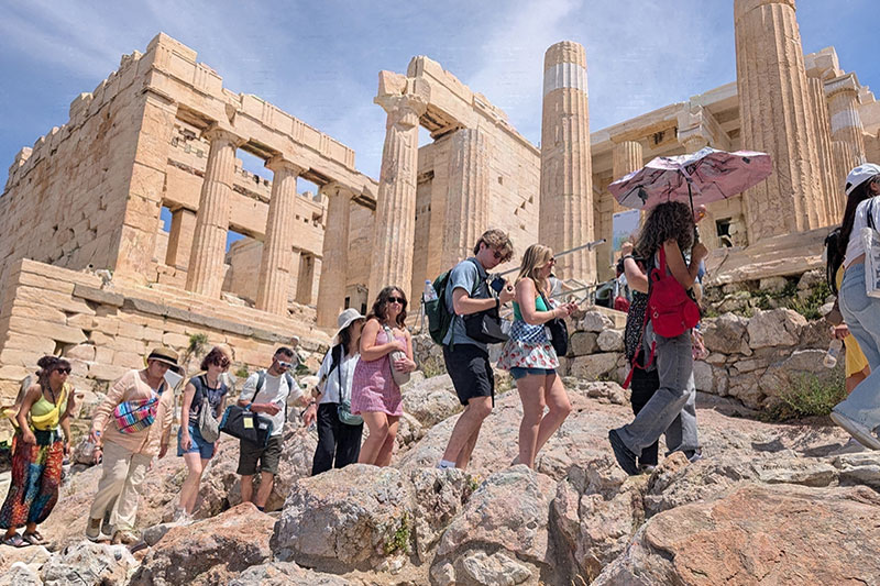 Group of people walking near the Acropolis