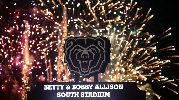 Fireworks behind a bear head at Allison South Stadium.