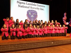 Members of Sigma Lambda Gamma celebrating the organization. 