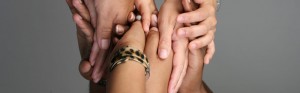 Hands reaching out; promotional photo for the Statewide Collaborative Diversity Conference  