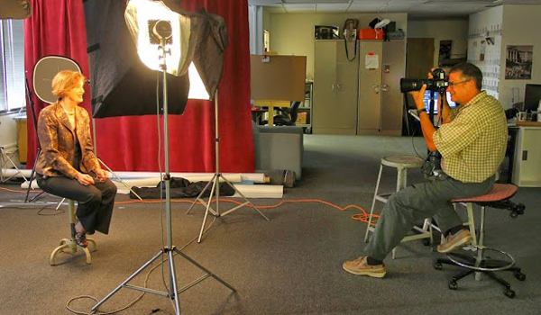 Faculty member being photographed during Free Portrait Days