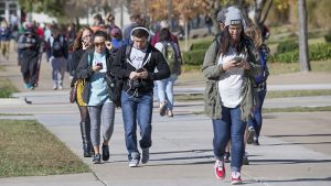 Campus scene with many students on mobile phones