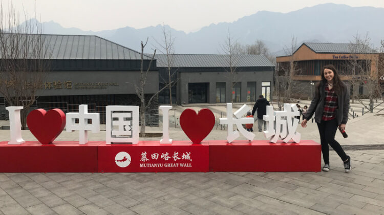 Photo of Samantha Tintner with a statue reading "I love China I love the great wall" (Photo Credit: Samantha Tintner)